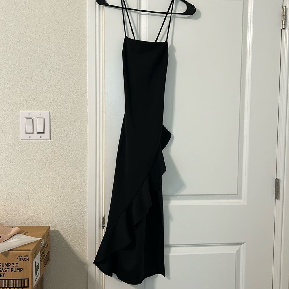 Black midi dress with ruffles. From Windsor